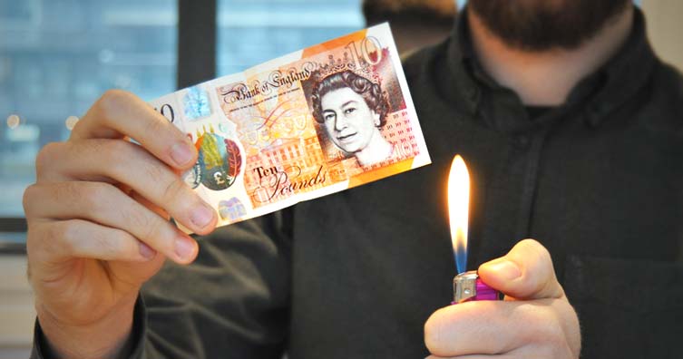 Burn waste destroy 10 pound note money