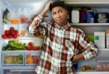 Confused man fridge cupboard kitchen food thinking