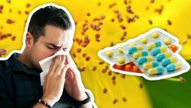 Man sneezing tissue allergic pollen flower hay fever medicine