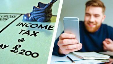 Monopoly board income tax happy man phone