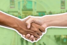 People shaking hands agreement deal shopping centre
